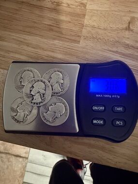 Lot of five 1942 silver quarters